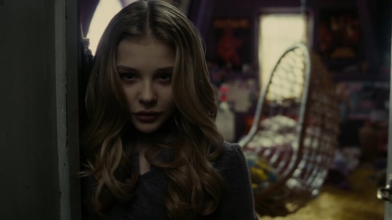 girl in a dimly lit room