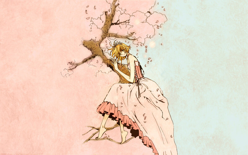 girl in a dress under cherry blossoms