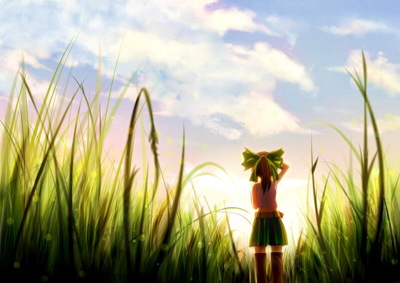 Girl in a field at sunset