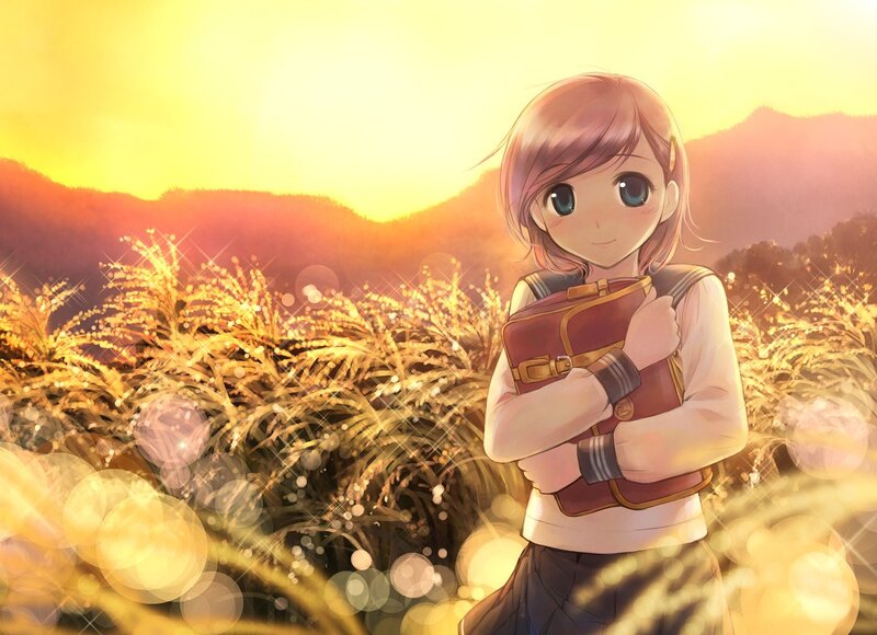 girl in a field at sunset