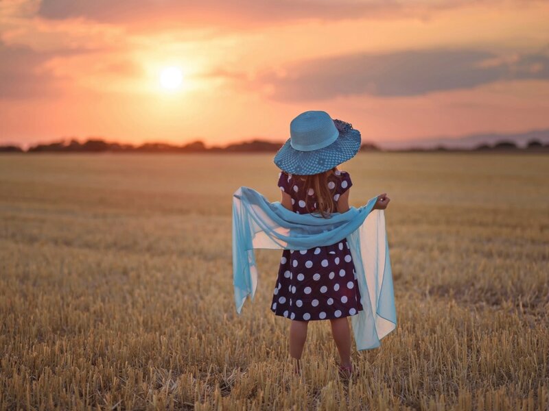 Girl in a Field — Blue, Serene, Sunset