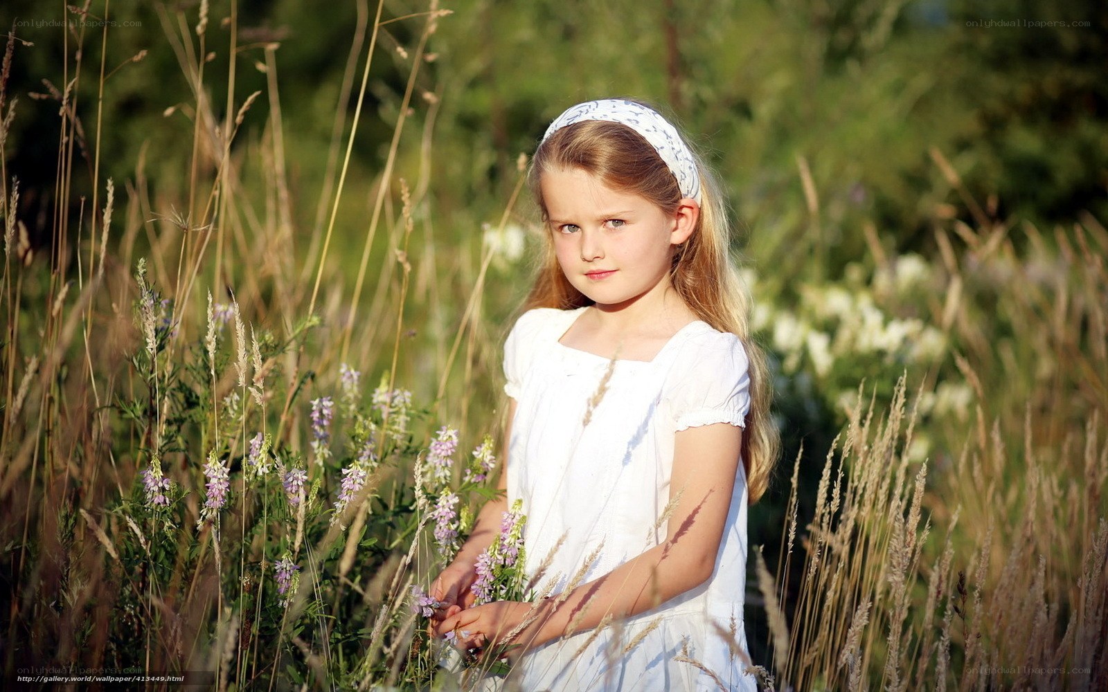 Girl in a field of wildflowers