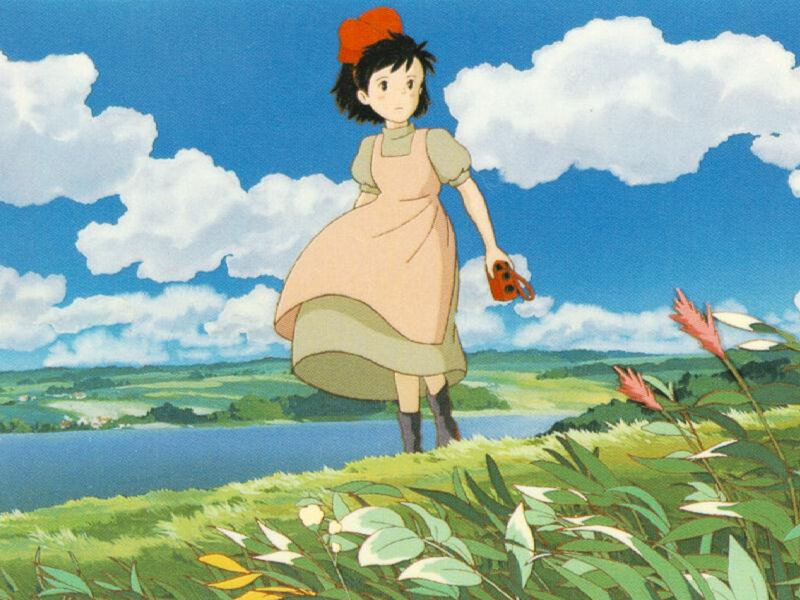 Girl in a field with a ladybug