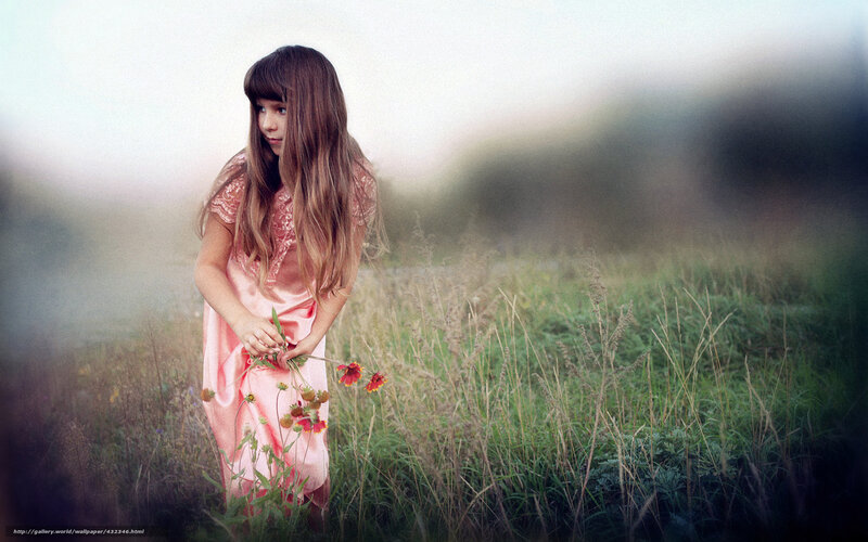 Girl in a field with flowers