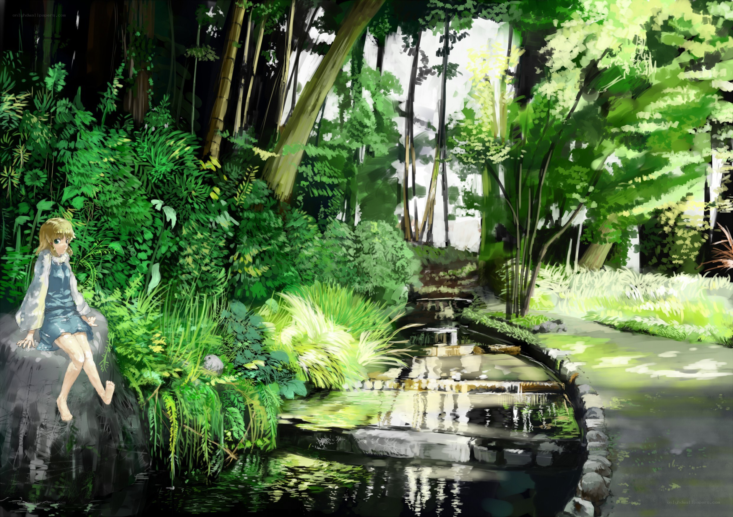 Girl in a forest stream