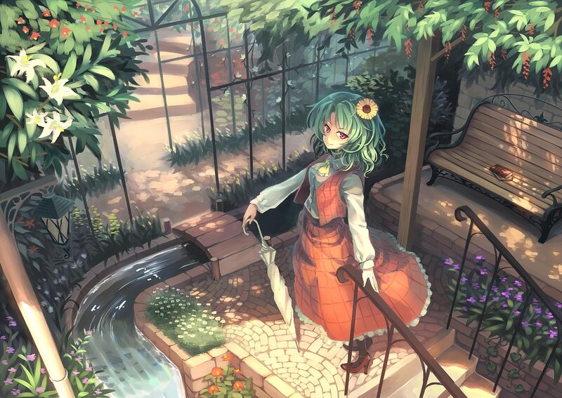 Girl in a garden with umbrella