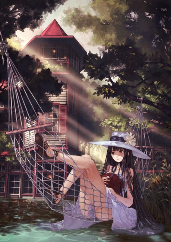 Girl in a hammock by the water