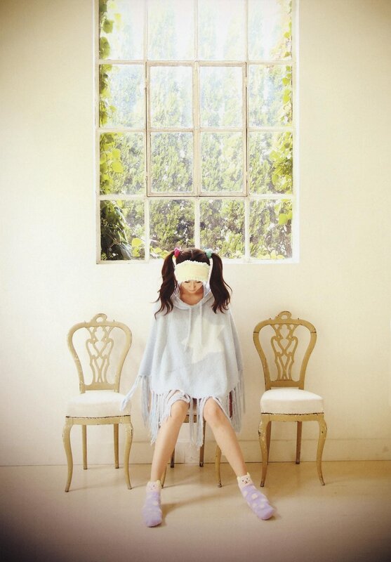 Girl in a light blue poncho