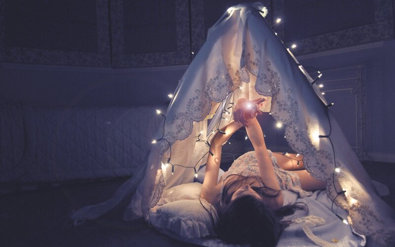 Girl in a lighted tent