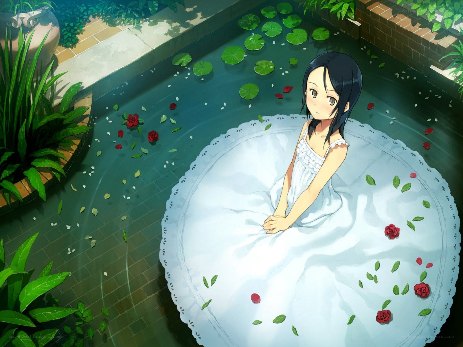Girl in a pool with flowers
