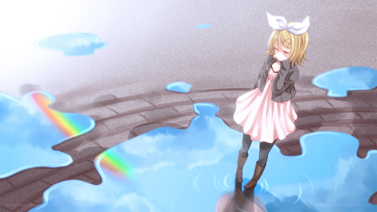 girl in a puddle with rainbow