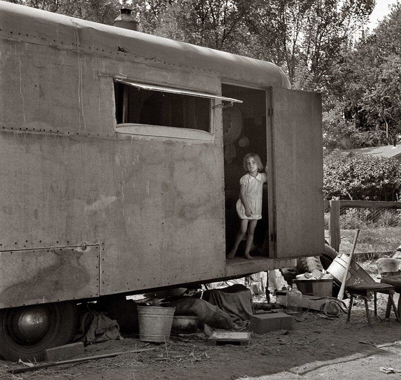 Girl in a trailer doorway