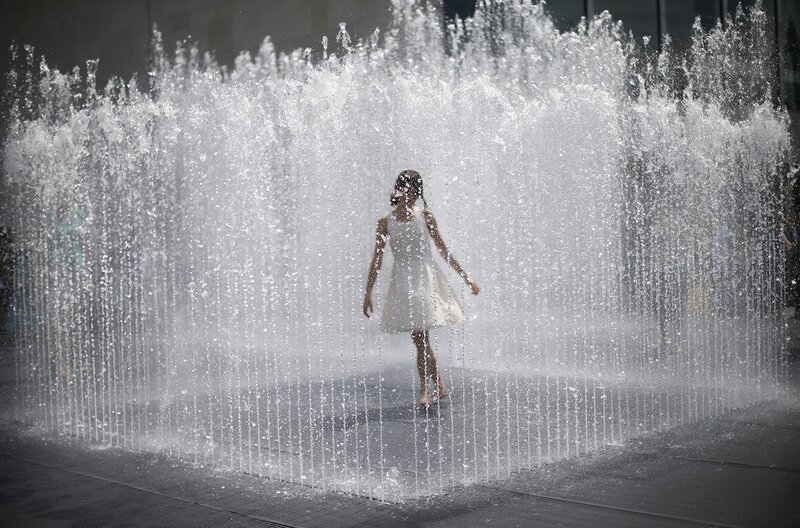 Girl in a water fountain