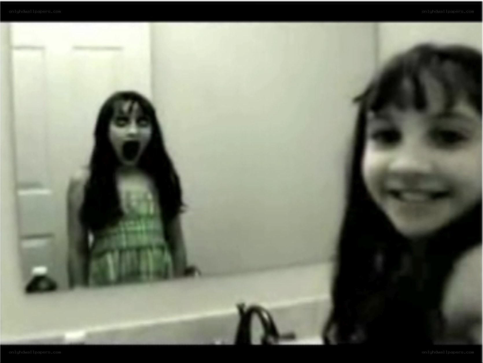 girl in bathroom mirror