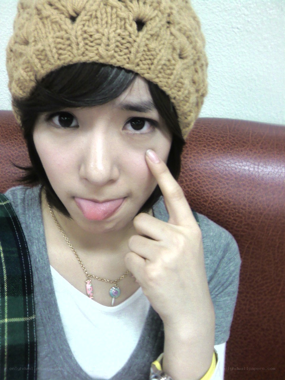 girl in beanie making face