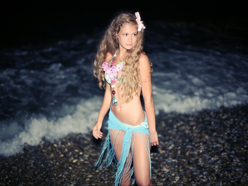girl in bikini at night beach