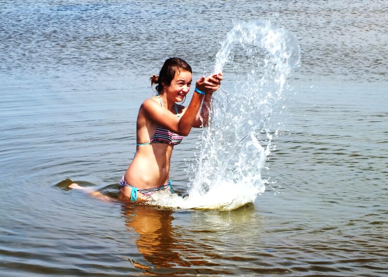 Girl in Bikini Splashing Water — Blue