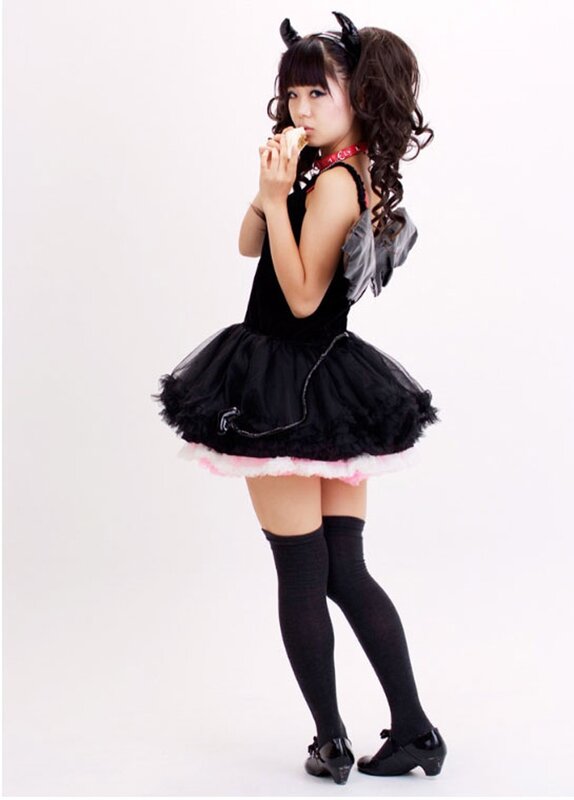 girl in black costume eating