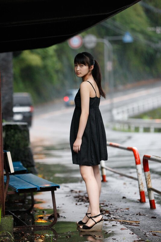 Girl in black dress on rainy day