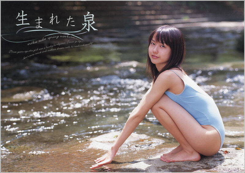 Girl in blue swimsuit by stream