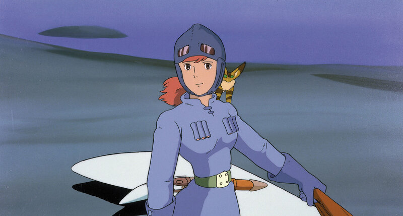 girl in blue uniform on surfboard