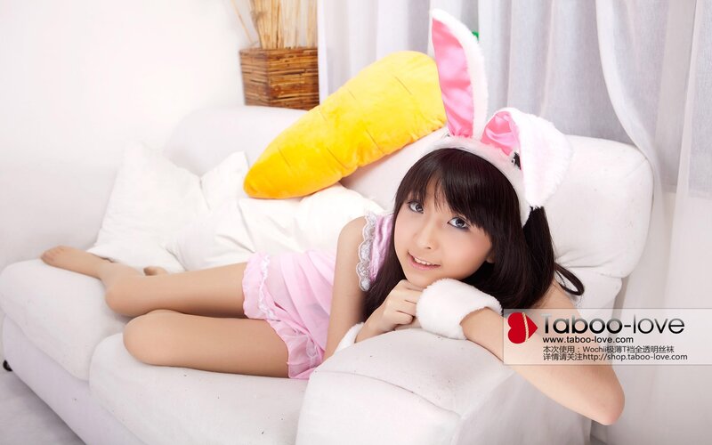 girl in bunny costume on couch