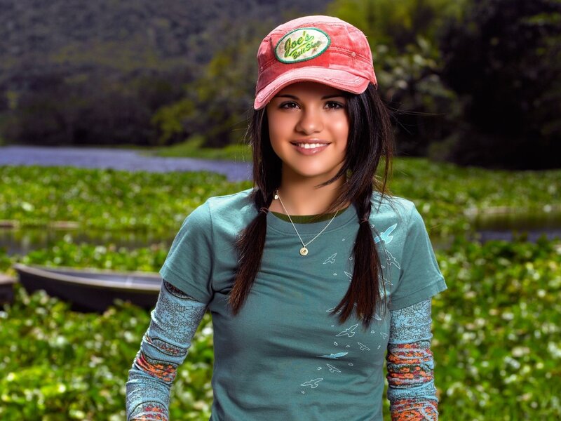 girl in cap by the river