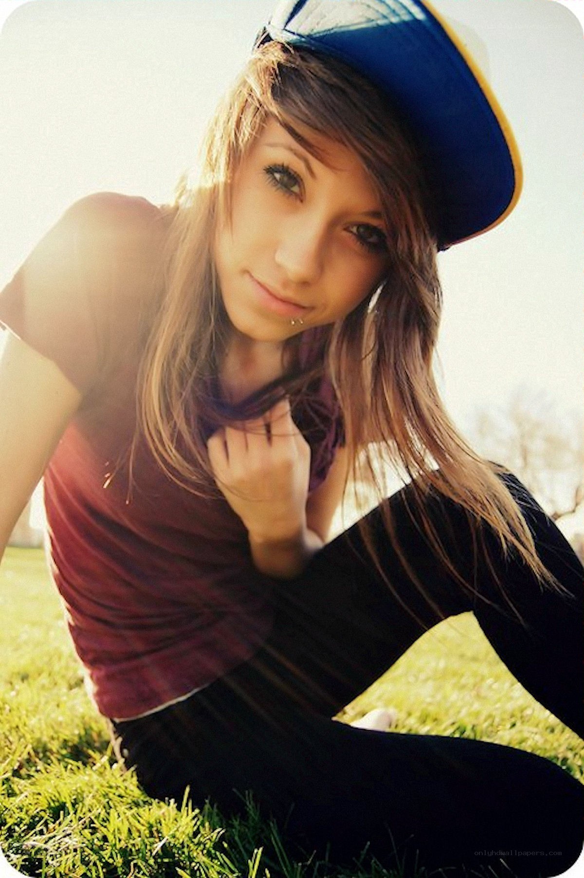 girl in cap on grass