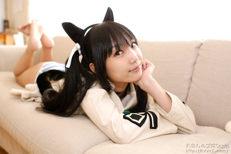 girl in cat ears on couch