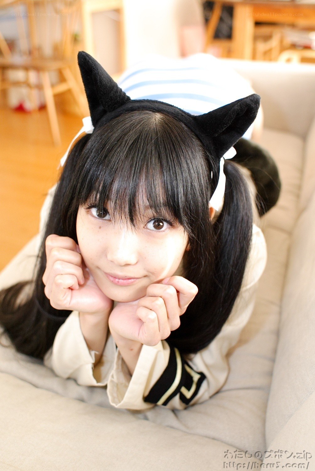 girl in cat ears on couch