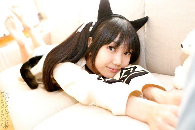 girl in cat ears on couch