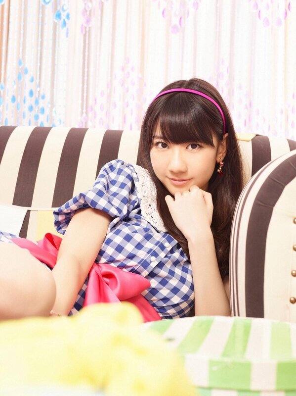 girl in checkered dress sitting