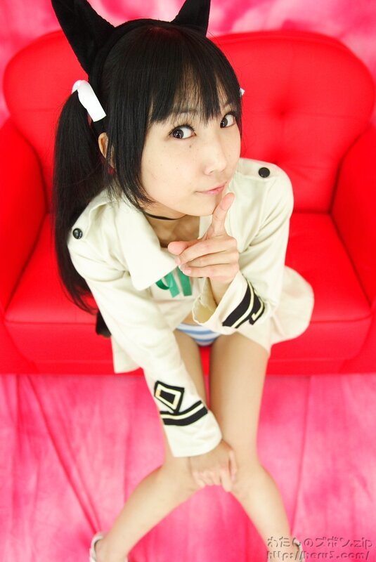 girl in cosplay on red couch