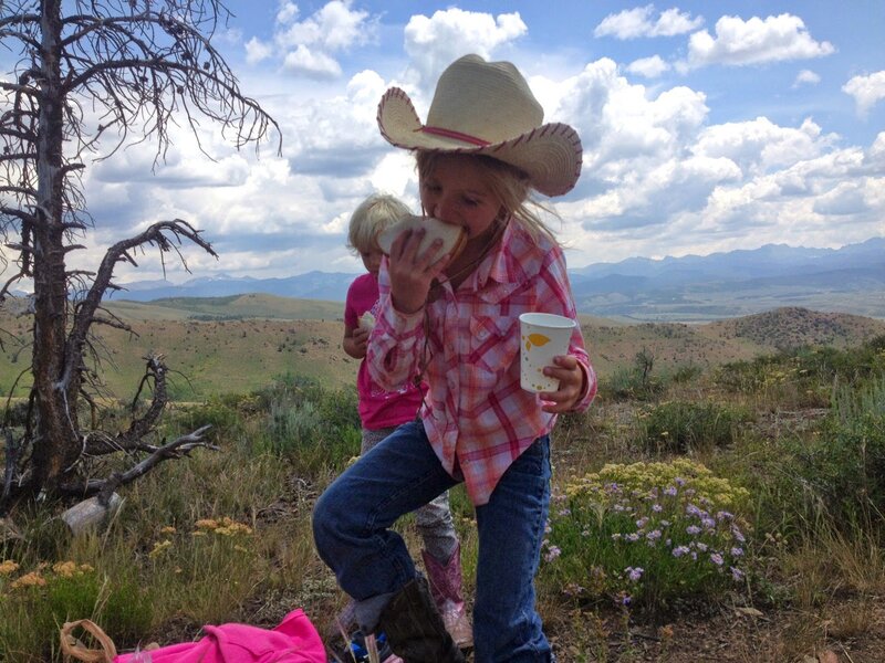 Girl in Cowboy Hat Eating