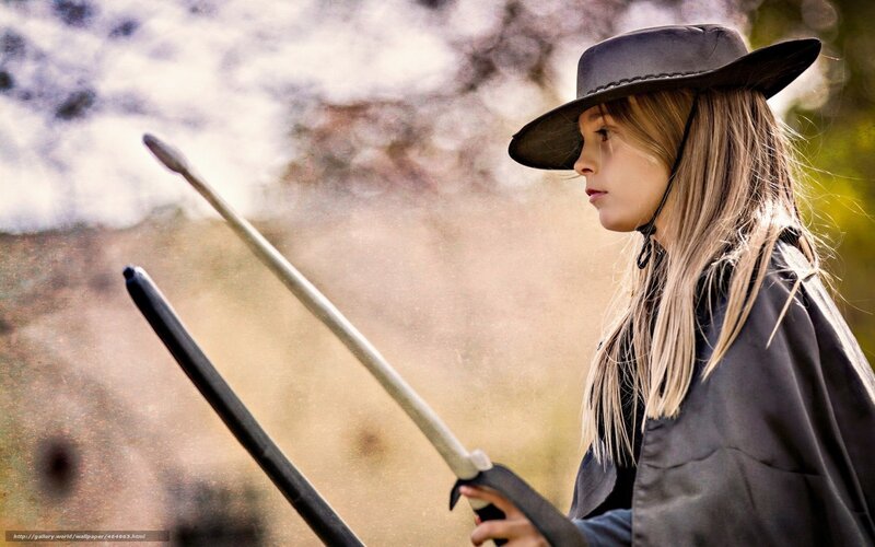 girl in cowboy hat with sword