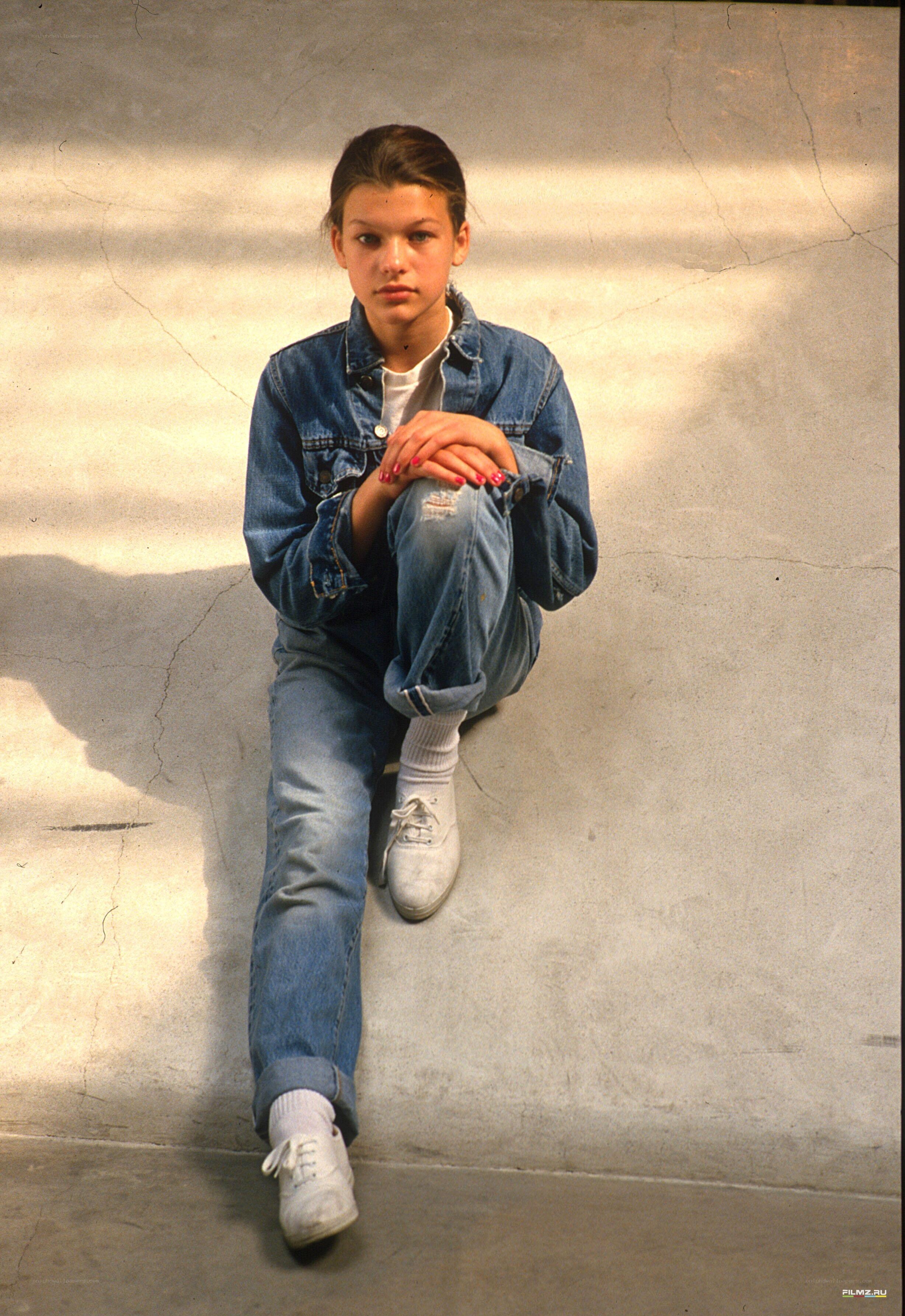 girl in denim jacket sitting