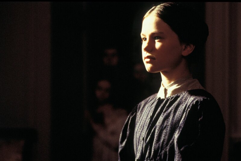 girl in dimly lit room