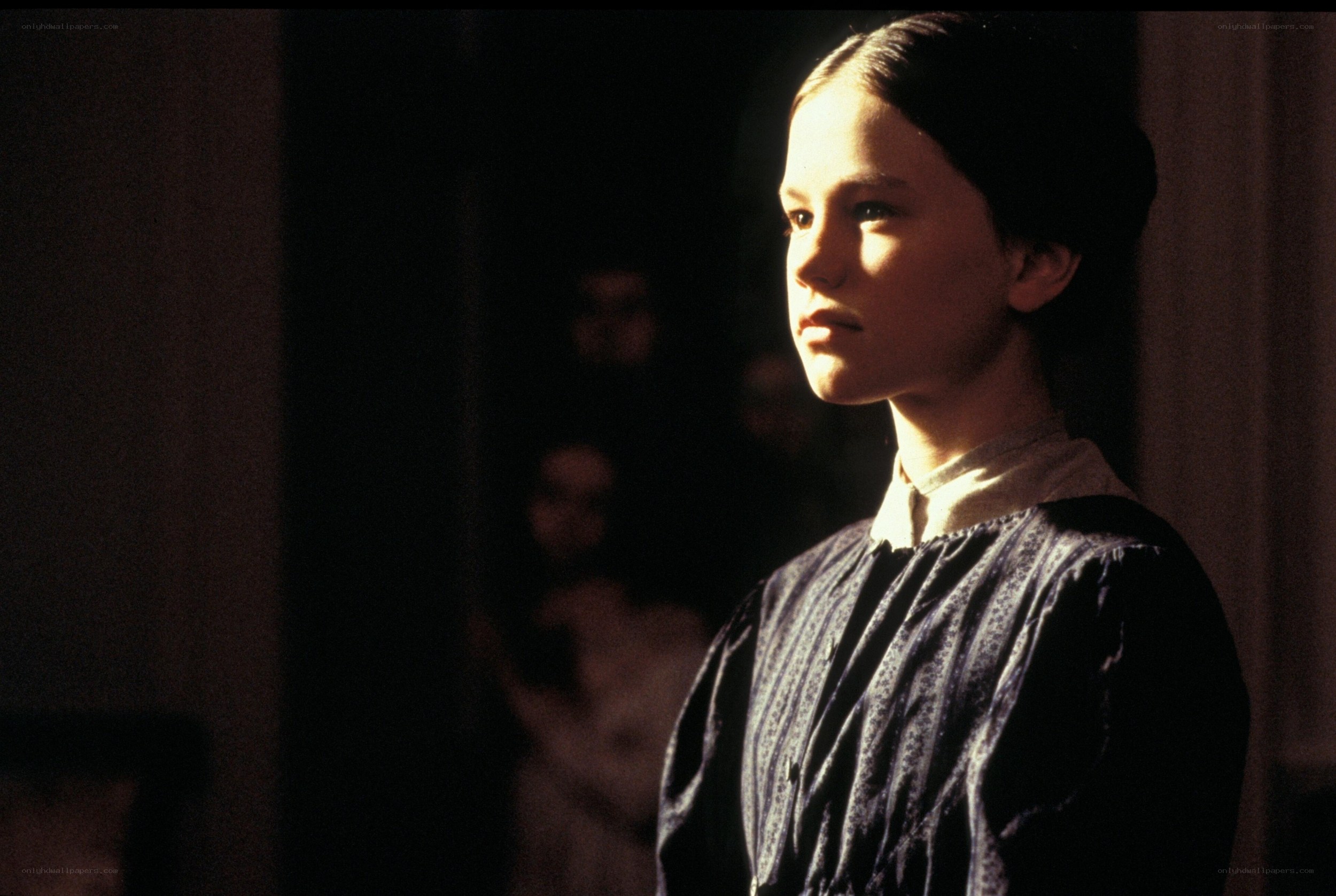 girl in dimly lit room