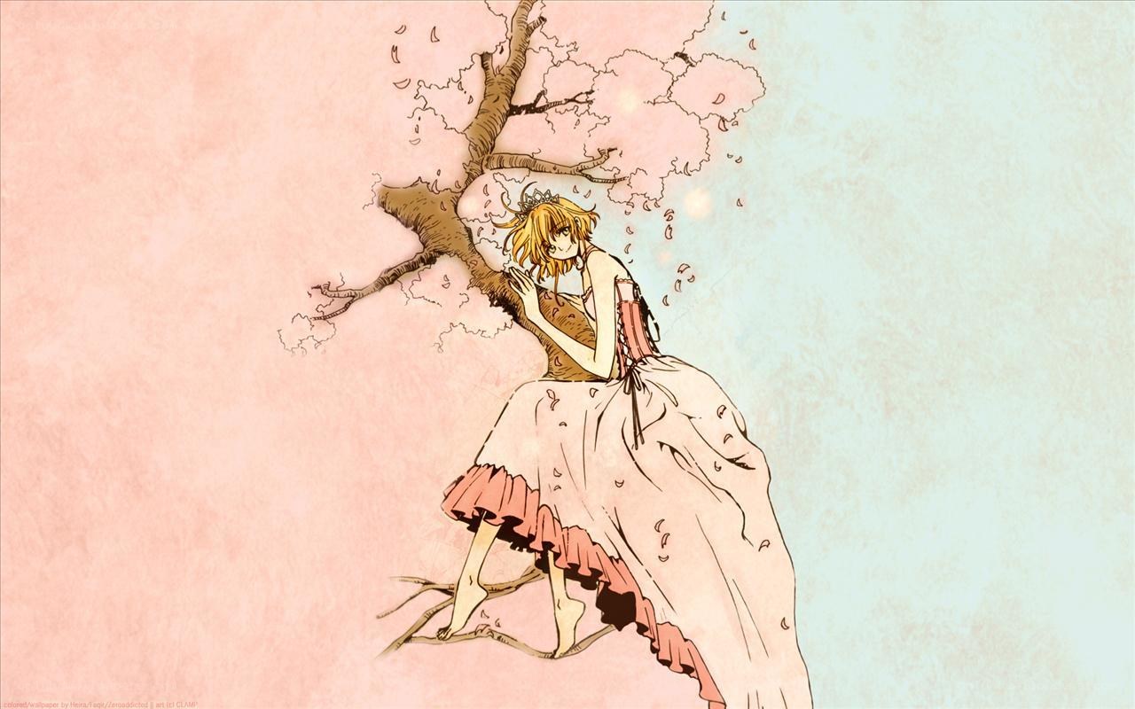 girl in dress under cherry tree