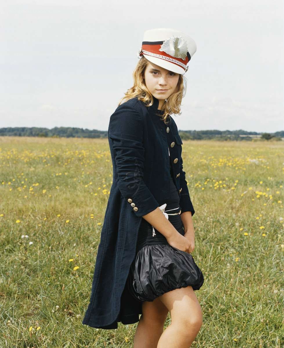 girl in field wearing hat