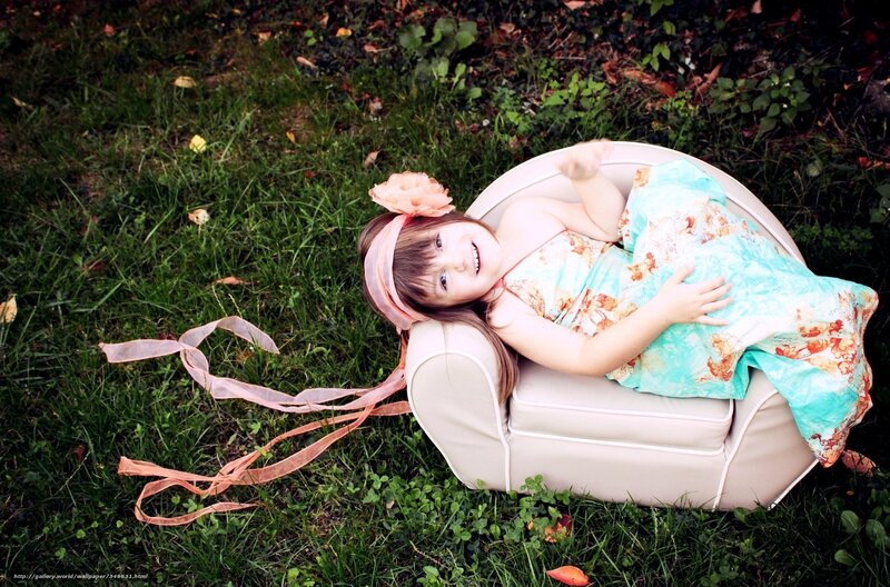 Girl in floral dress on lawn