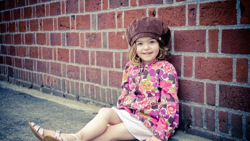 girl in floral dress sitting