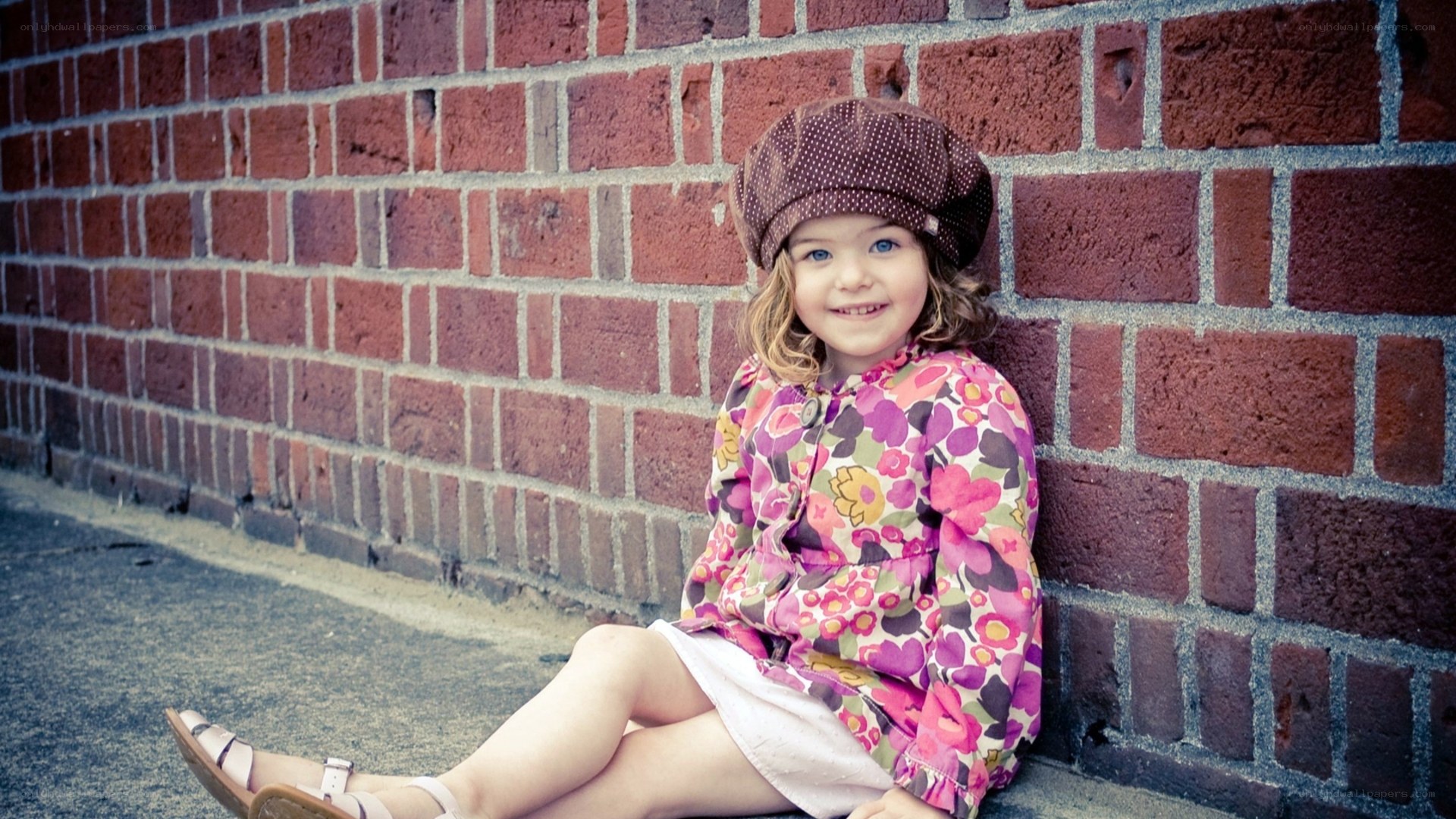 girl in floral dress sitting