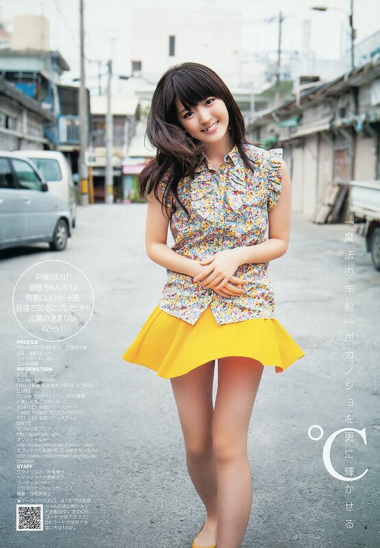 girl in floral top and yellow skirt
