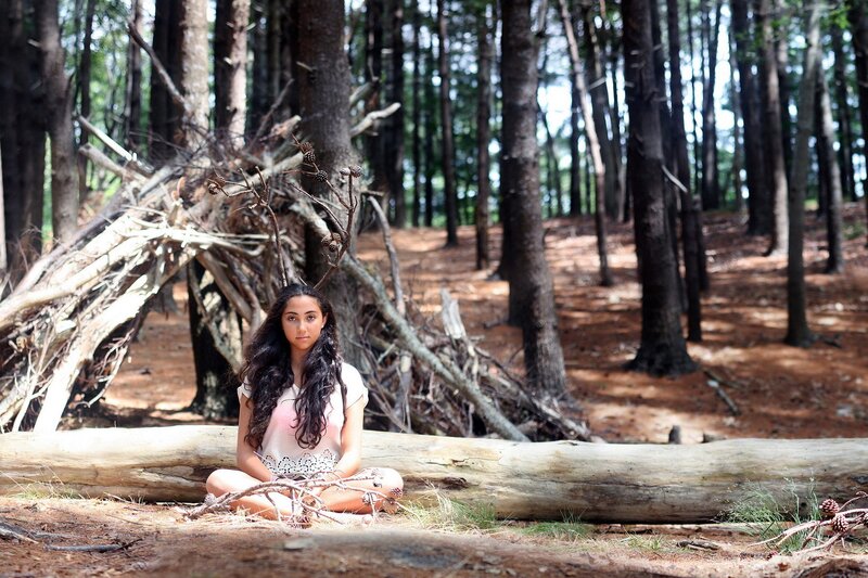 Girl in forest with antlers