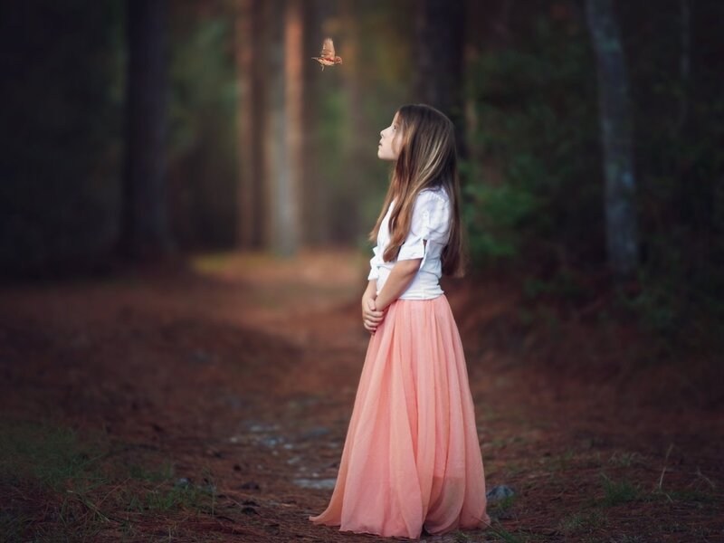 Girl in Forest with Bird