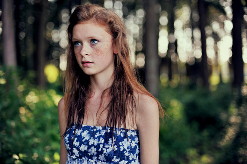 girl in forest with freckles