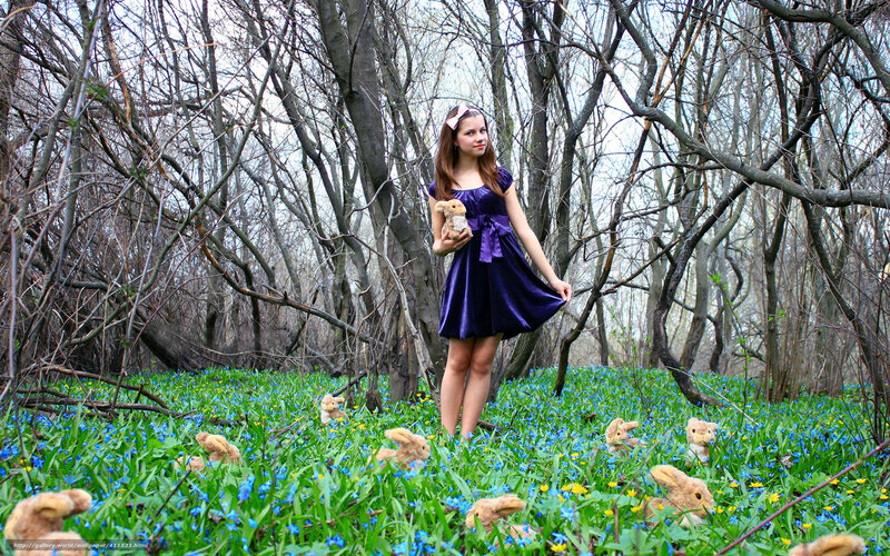 Girl in forest with stuffed animals