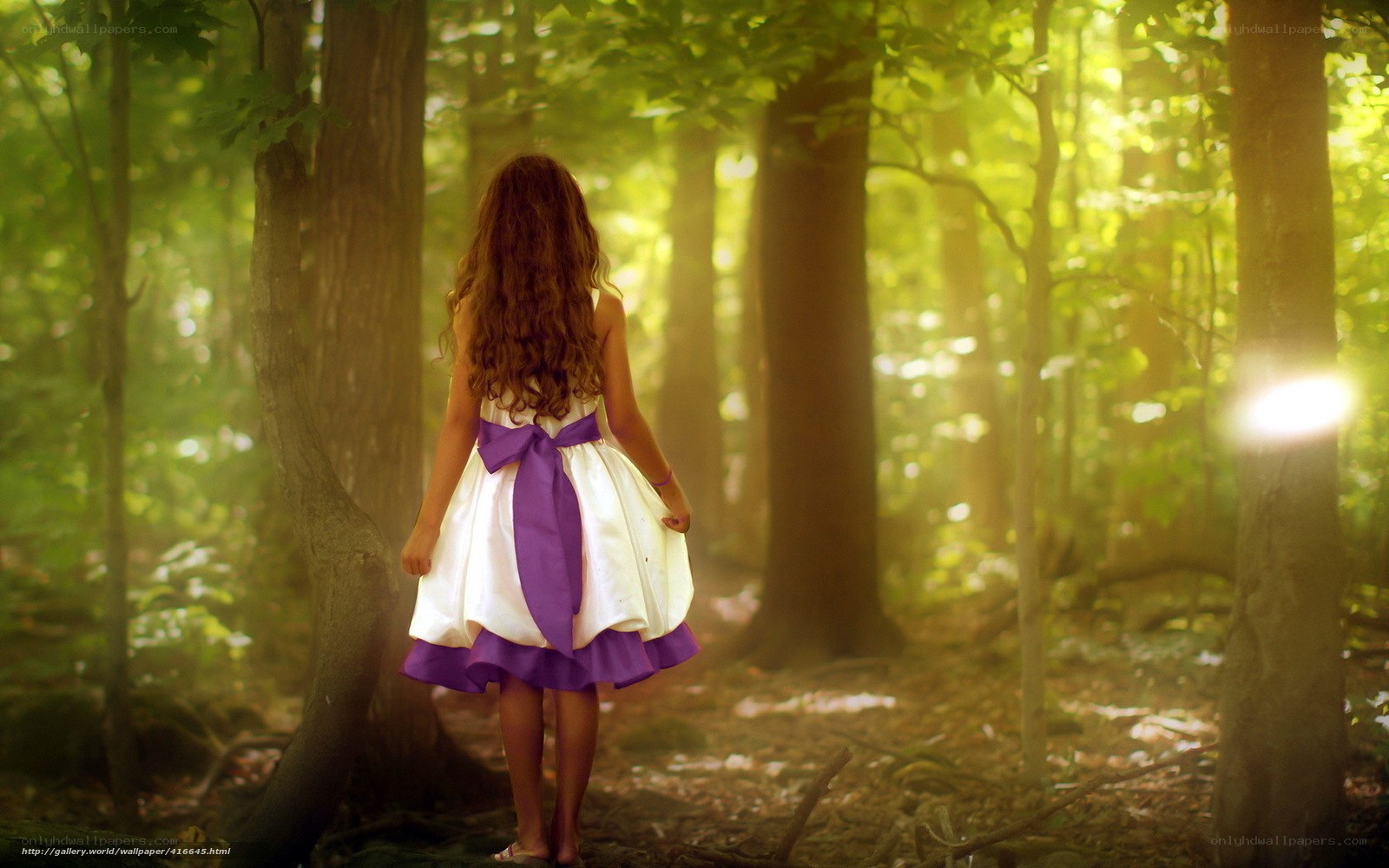 Girl in forest with sunlight