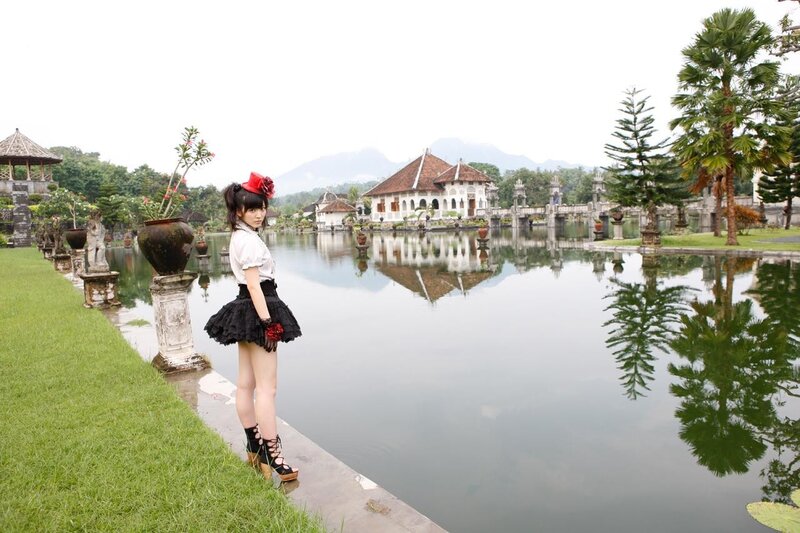 Girl in garden by lake